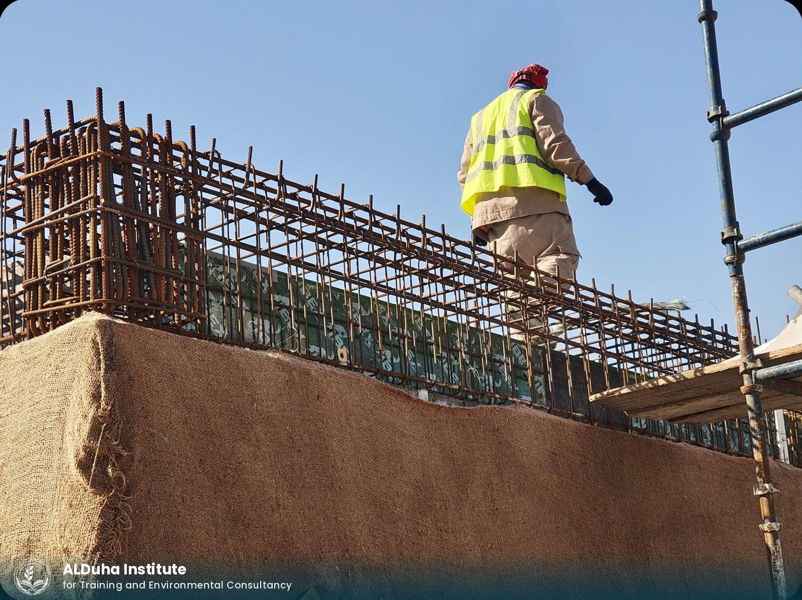 Wall-top reinforcement with hessian curing cover in place
